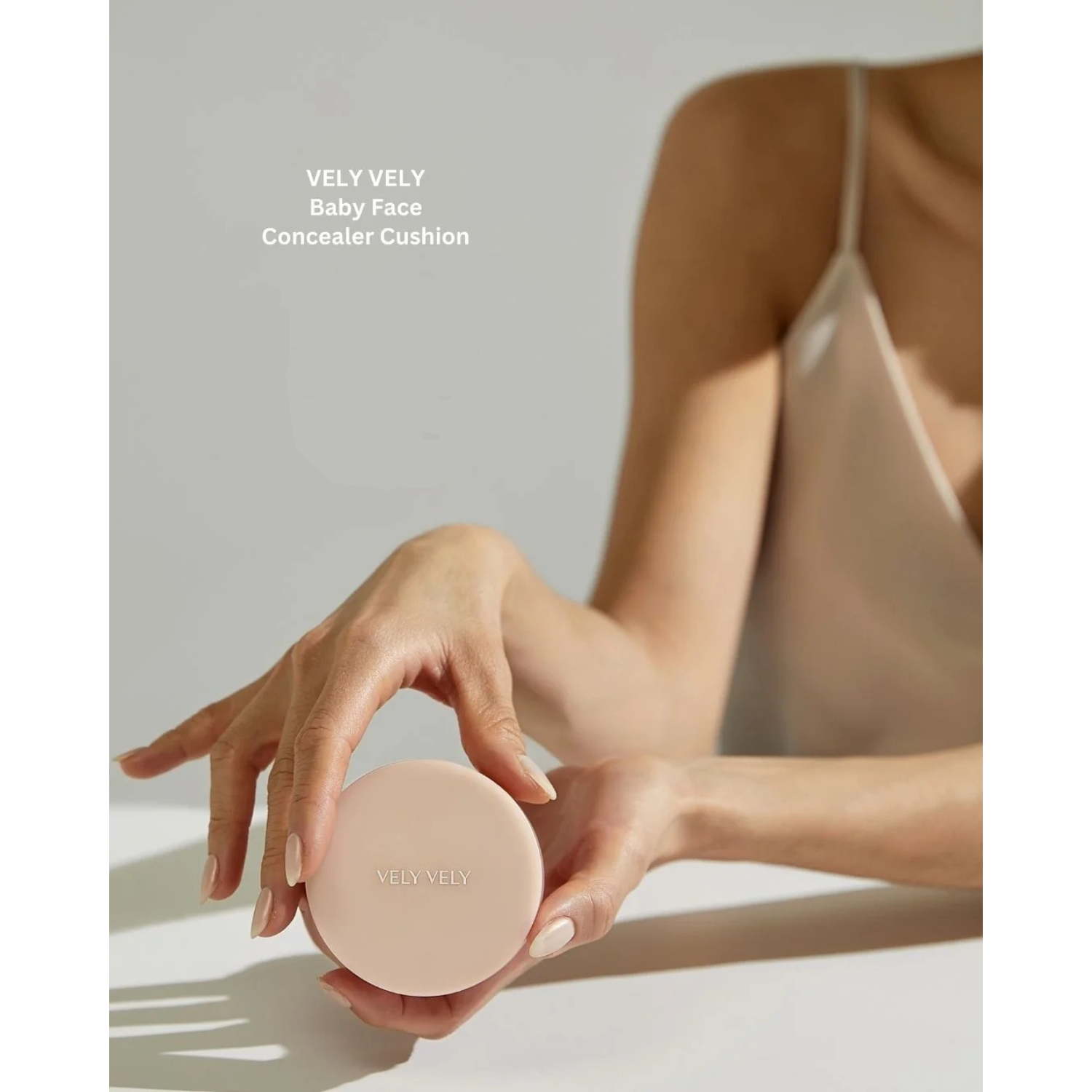Model Holding VELY_VELY_Baby_Face_Concealer_Cushion KBEAUTY X